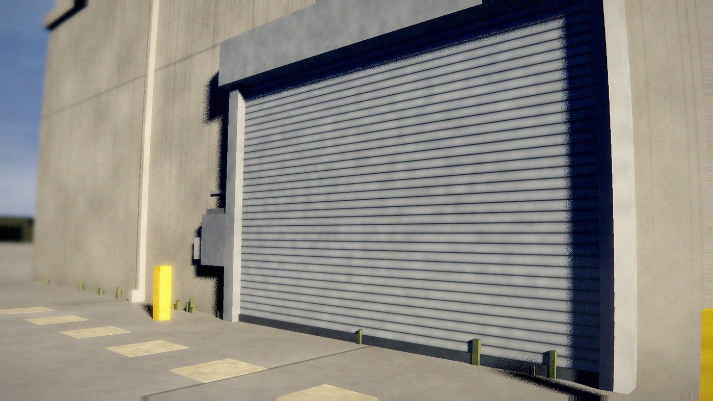 Rolling steel service door and guide rail on a commercial building